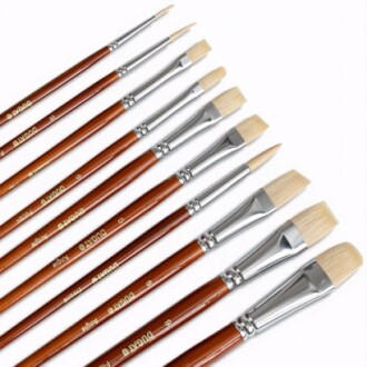 Set of artist paint brushes with wooden handles.