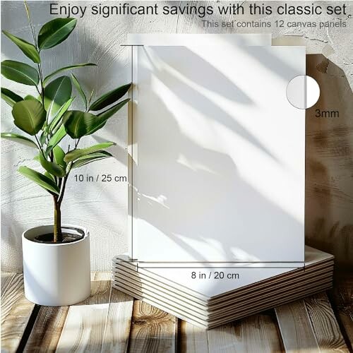 Stack of canvas panels with plant and measurements.