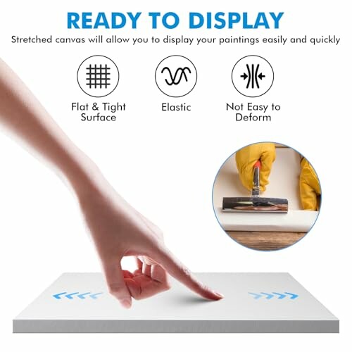 Hand touching a flat canvas surface with highlighted features of the canvas.