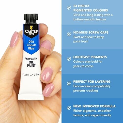 Hand holding a tube of Castle Arts cobalt blue oil paint with benefits listed.