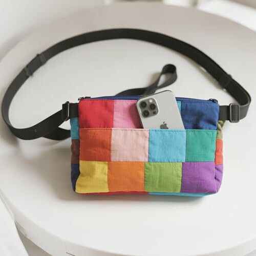 Colorful patchwork bag with smartphone inside.