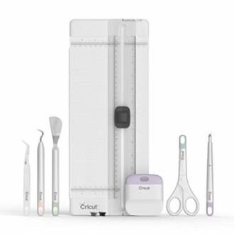 Cricut crafting tools set including trimmer and accessories.