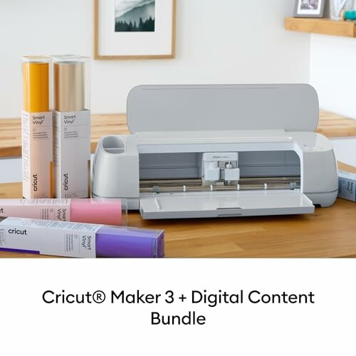 Cricut Maker 3 machine with colorful vinyl rolls on a wooden table.