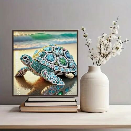 Decorative turtle art piece next to a vase with flowers.