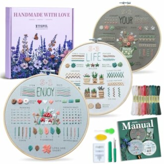 Embroidery starter kit with hoops, threads, and manual.