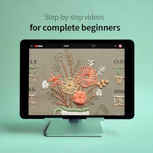 Tablet displaying embroidery tutorial for beginners.