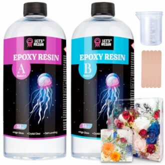 Epoxy resin kit with bottles, measuring cup, and sticks.
