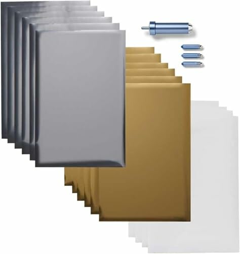 Foil transfer kit with silver, gold, and white sheets and tools.