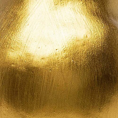 Close-up of a textured gold surface with a shiny finish.