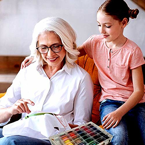 Grandmother and granddaughter doing embroidery together.