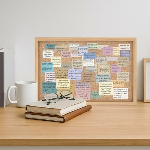 Corkboard with various inspirational quotes on sticky notes.
