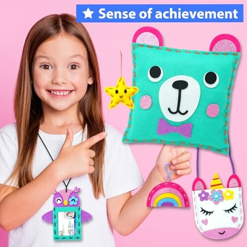 Girl showing DIY craft kit with bear pillow, star, rainbow, and unicorn designs.