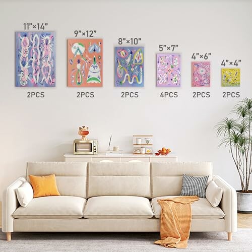 Living room with a beige sofa and colorful art pieces of various sizes on the wall.