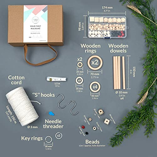 Macrame kit contents with beads, wooden rings, dowels, cotton cord, hooks, and needle threader.