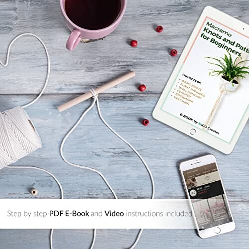 Macrame tutorial e-book and tools on a table with a tablet, phone, and yarn.