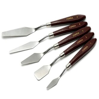 Set of five painting palette knives with wooden handles.