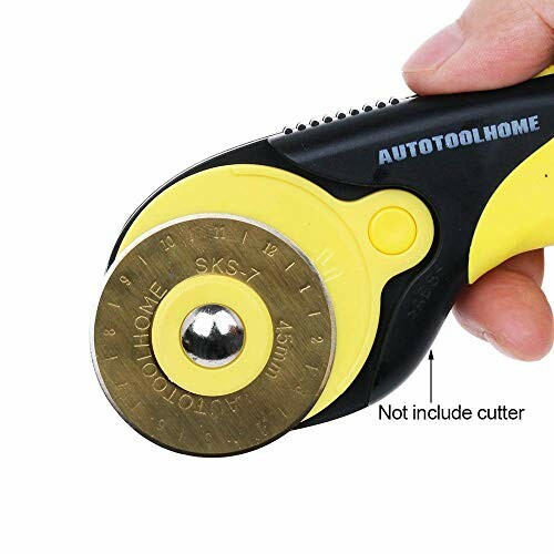 Hand holding a rotary cutter tool with a circular blade.