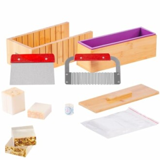 Soap making kit with molds, cutters, and accessories.