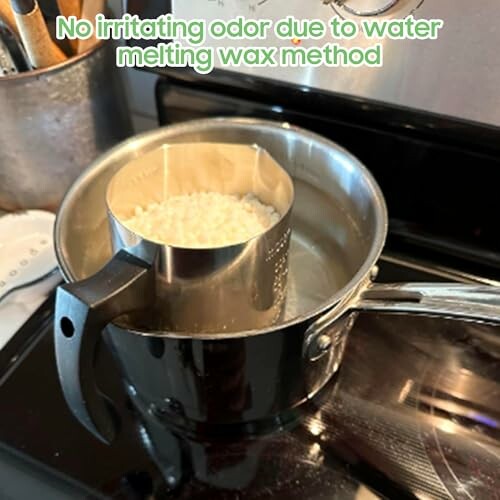 Wax melting in a double boiler on a stove.