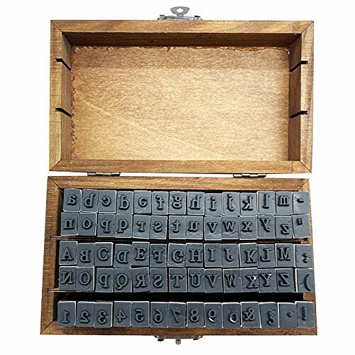 Wooden box containing alphabet and number stamps.